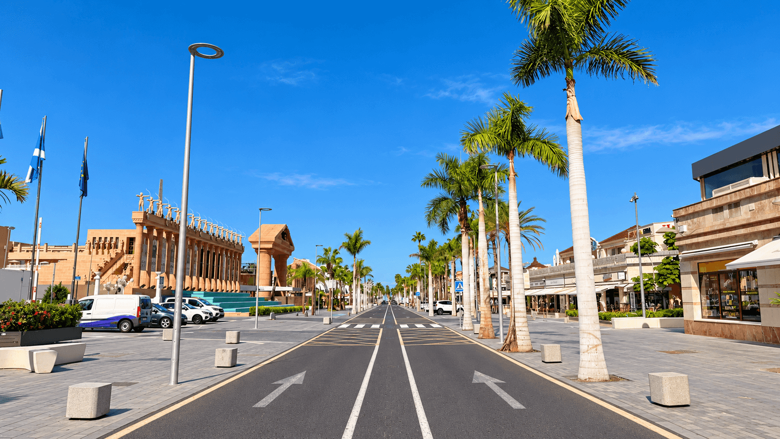 Palm-lined Golden Mile in Playa de Las Américas, Tenerife with shops, restaurants and pedestrian areas
