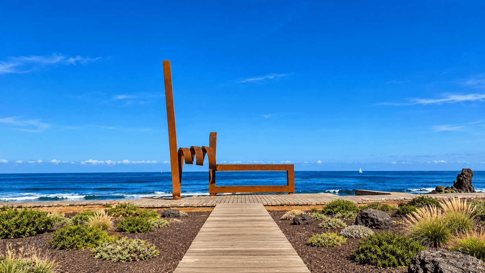 Coastal promenade with contemporary sculpture and Atlantic Ocean views