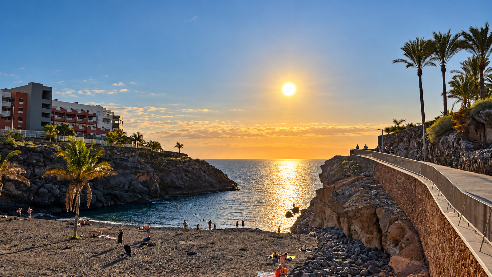 Sunset over the Atlantic Ocean and coastal cove in Playa Paraíso, Tenerife